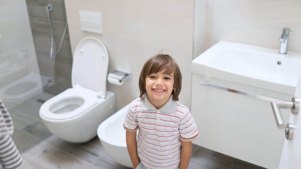 Child in an ADA compliant bathroom after remodel